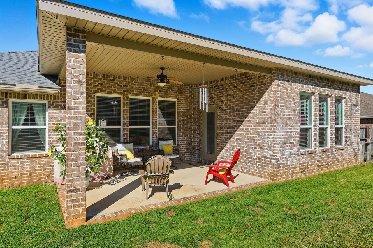 3025 Crown Creek Circle Crestview, FL 32539 - Photo 41 of 46 a backyard of a house with table and chairs