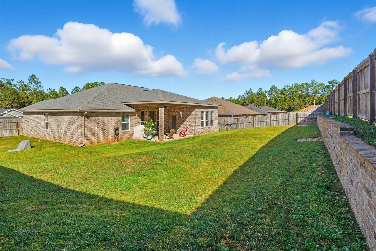3025 Crown Creek Circle Crestview, FL 32539 - Photo 42 of 46 a view of a house with a backyard