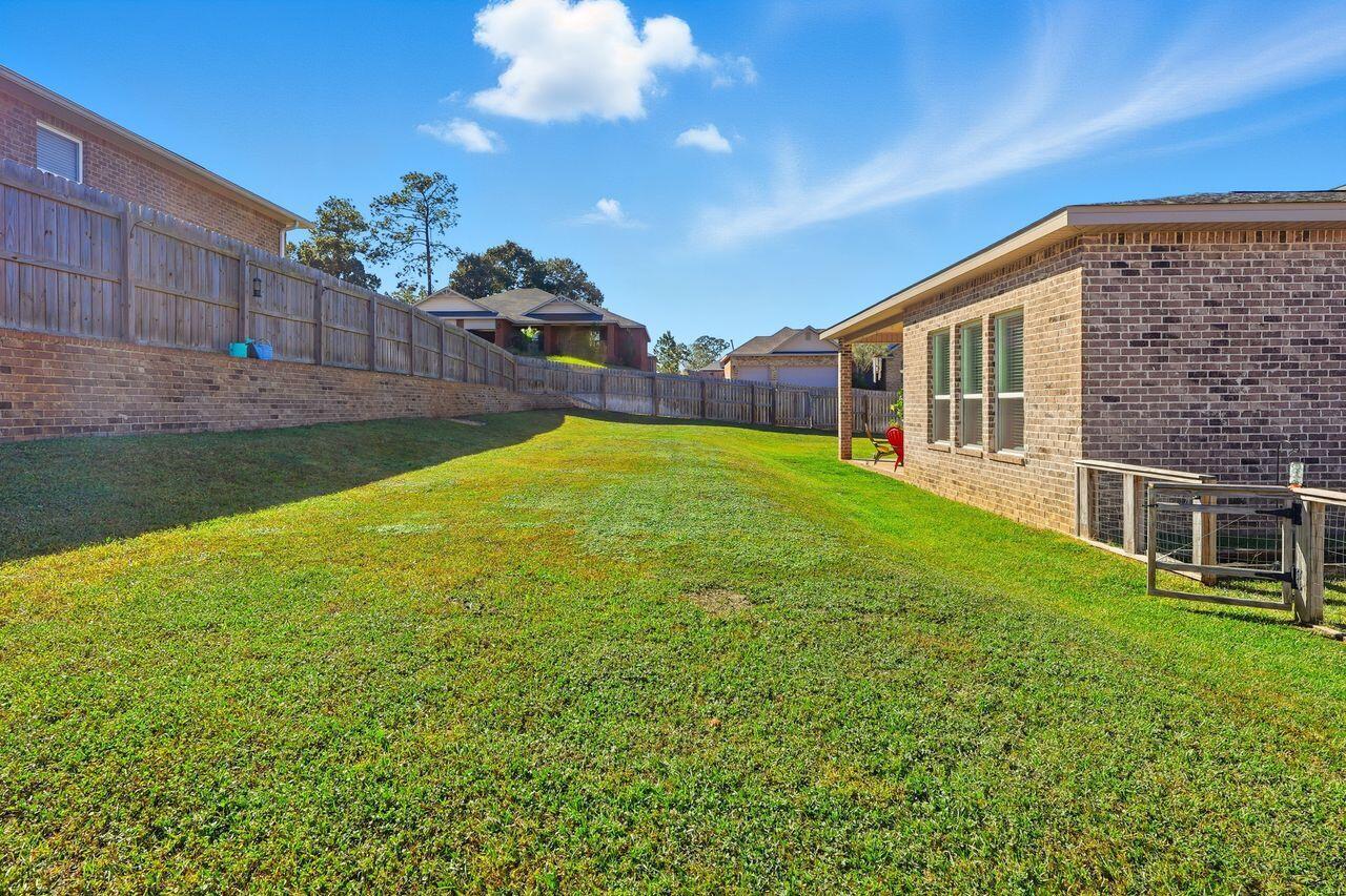 3025 Crown Creek Circle Crestview, FL 32539 - Photo 44 of 46 a view of a house with a yard
