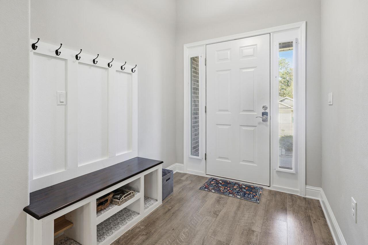 3025 Crown Creek Circle Crestview, FL 32539 - Photo 5 of 46 a view of an empty room with wooden floor and a window