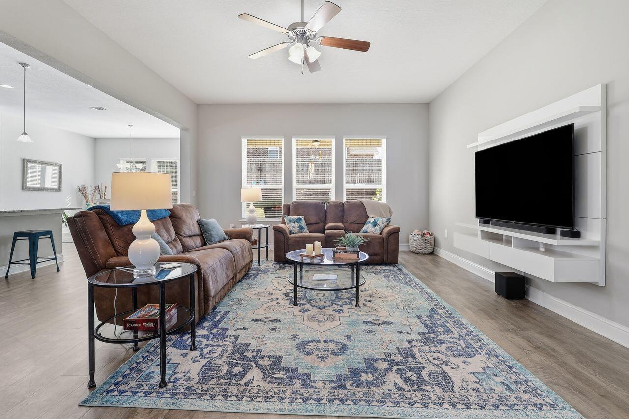 3025 Crown Creek Circle Crestview, FL 32539 - Photo 7 of 46 a living room with furniture and a flat screen tv