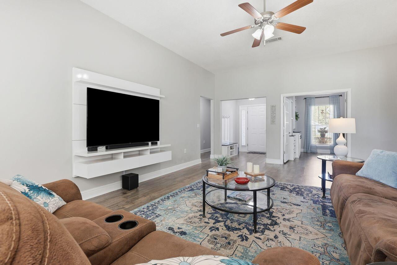 3025 Crown Creek Circle Crestview, FL 32539 - Photo 9 of 46 a living room with furniture and a flat screen tv