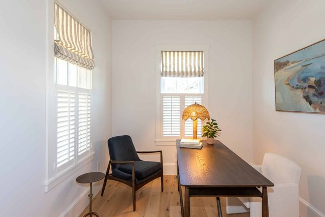 a workspace with furniture and a window
