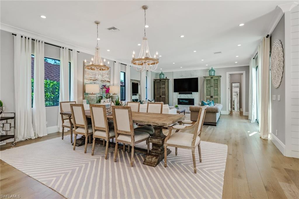 1919 Manchester Circle Naples, FL 34109 - Photo 44 of 45 a view of a dining room with furniture window and wooden floor
