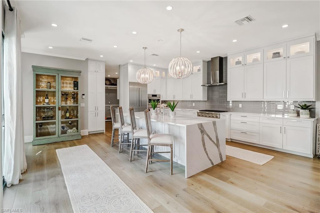 1919 Manchester Circle Naples, FL 34109 - Photo 2 of 45 a large kitchen with lots of counter space and appliances