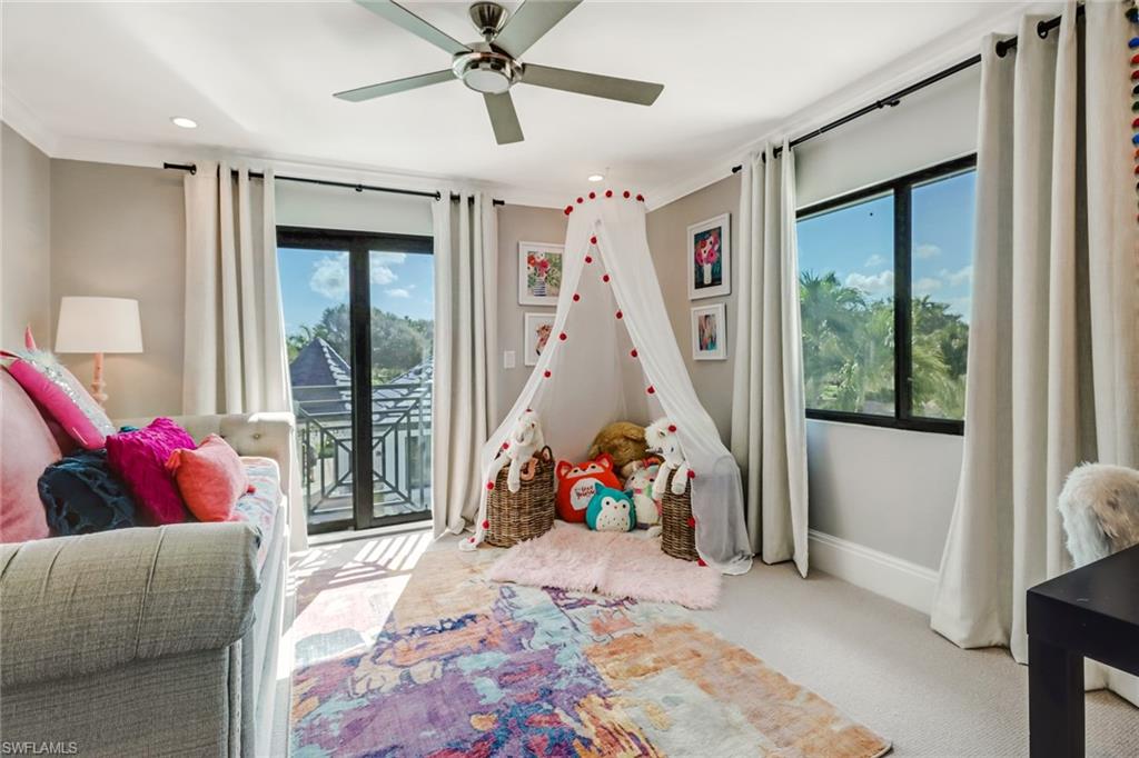 1919 Manchester Circle Naples, FL 34109 - Photo 25 of 45 a bed room with a bed and a window