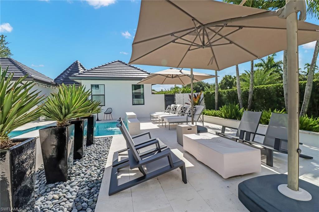 1919 Manchester Circle Naples, FL 34109 - Photo 33 of 45 a view of outdoor space yard and patio