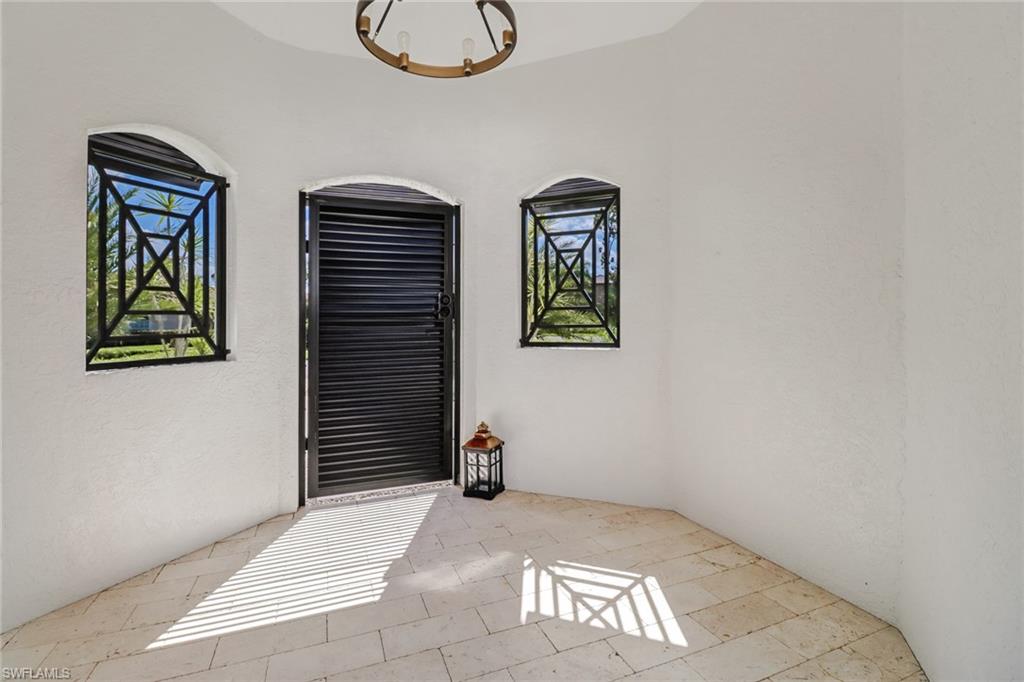 1919 Manchester Circle Naples, FL 34109 - Photo 36 of 45 a view of an entryway with wooden floor