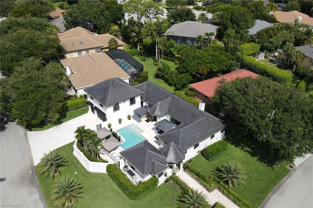 1919 Manchester Circle Naples, FL 34109 - Photo 37 of 45 an aerial view of a house with yard swimming pool and outdoor seating
