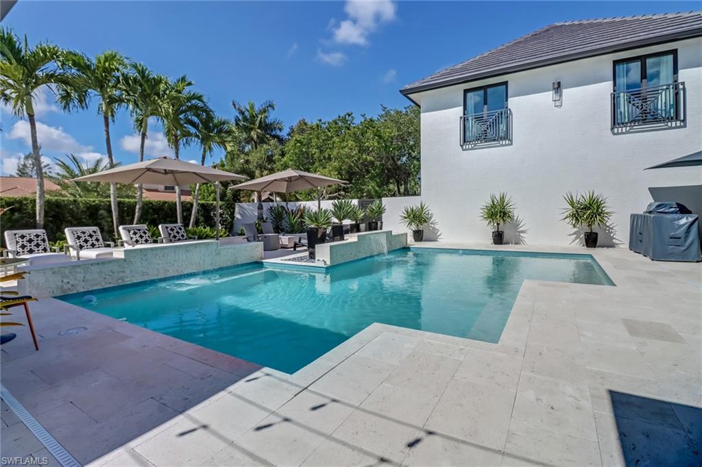 1919 Manchester Circle Naples, FL 34109 - Photo 10 of 45 a view of a house with a yard