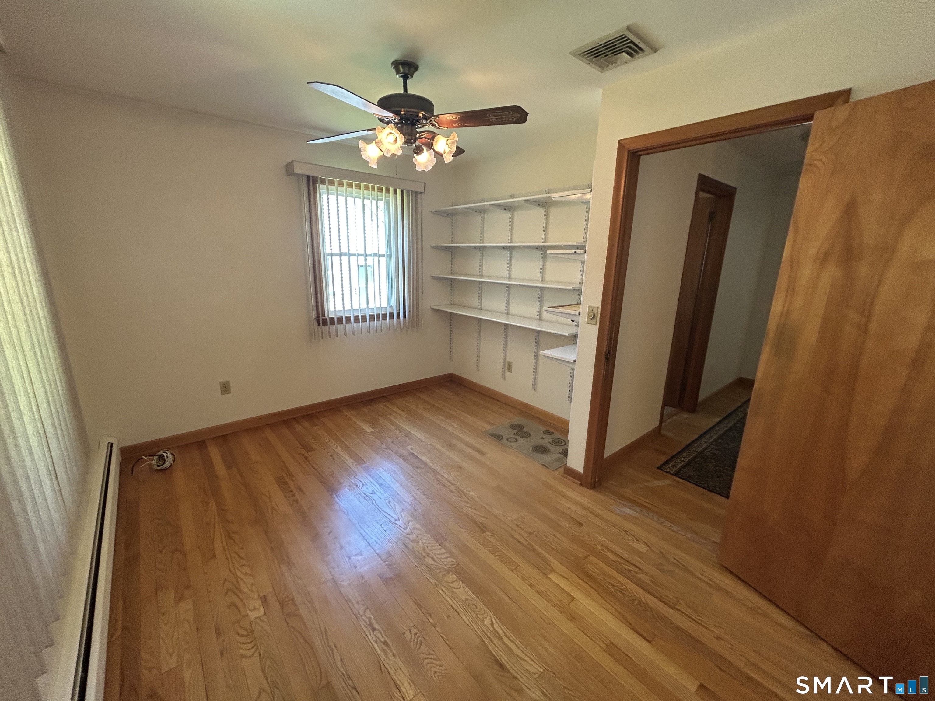 13 Walnut Lane Wallingford, CT 06492 - Photo 11 of 27 a view of livingroom with hardwood floor and window