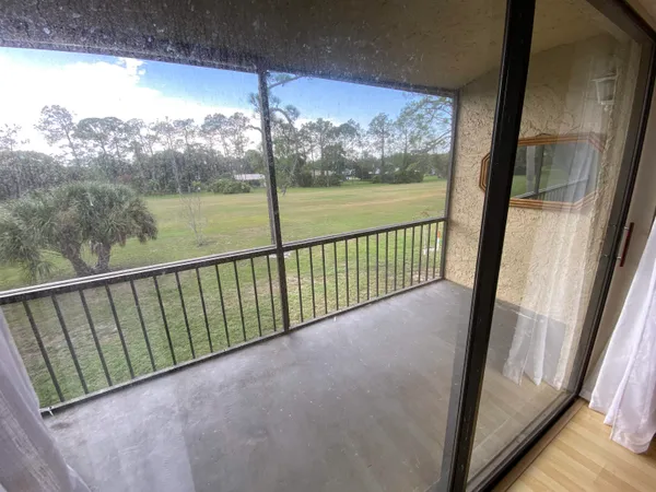 a view of balcony with furniture