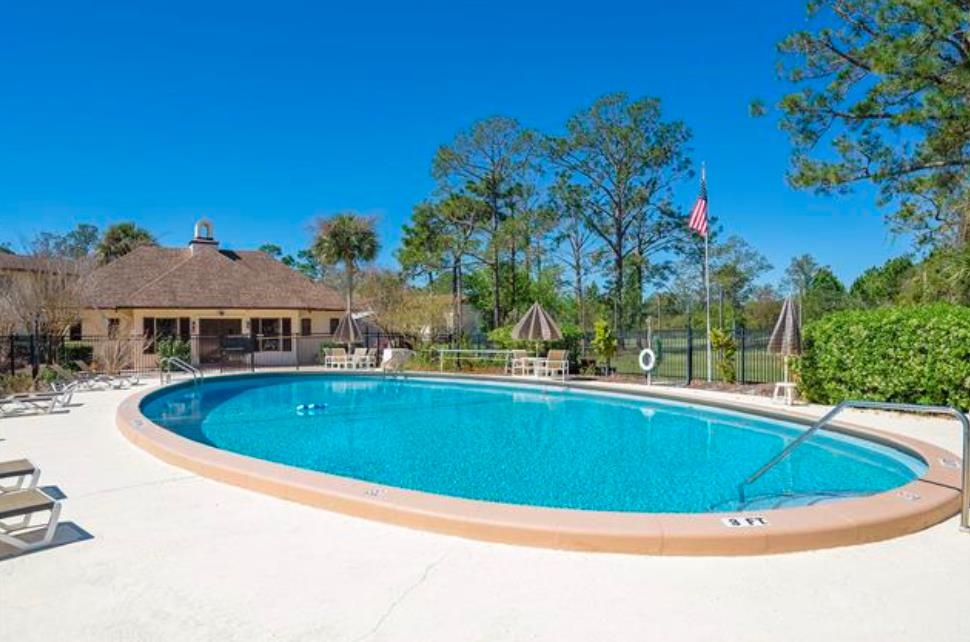 600 Domenico Circle, Unit C16 St. Augustine, FL 32086 - Photo 22 of 23 a view of a swimming pool and a yard