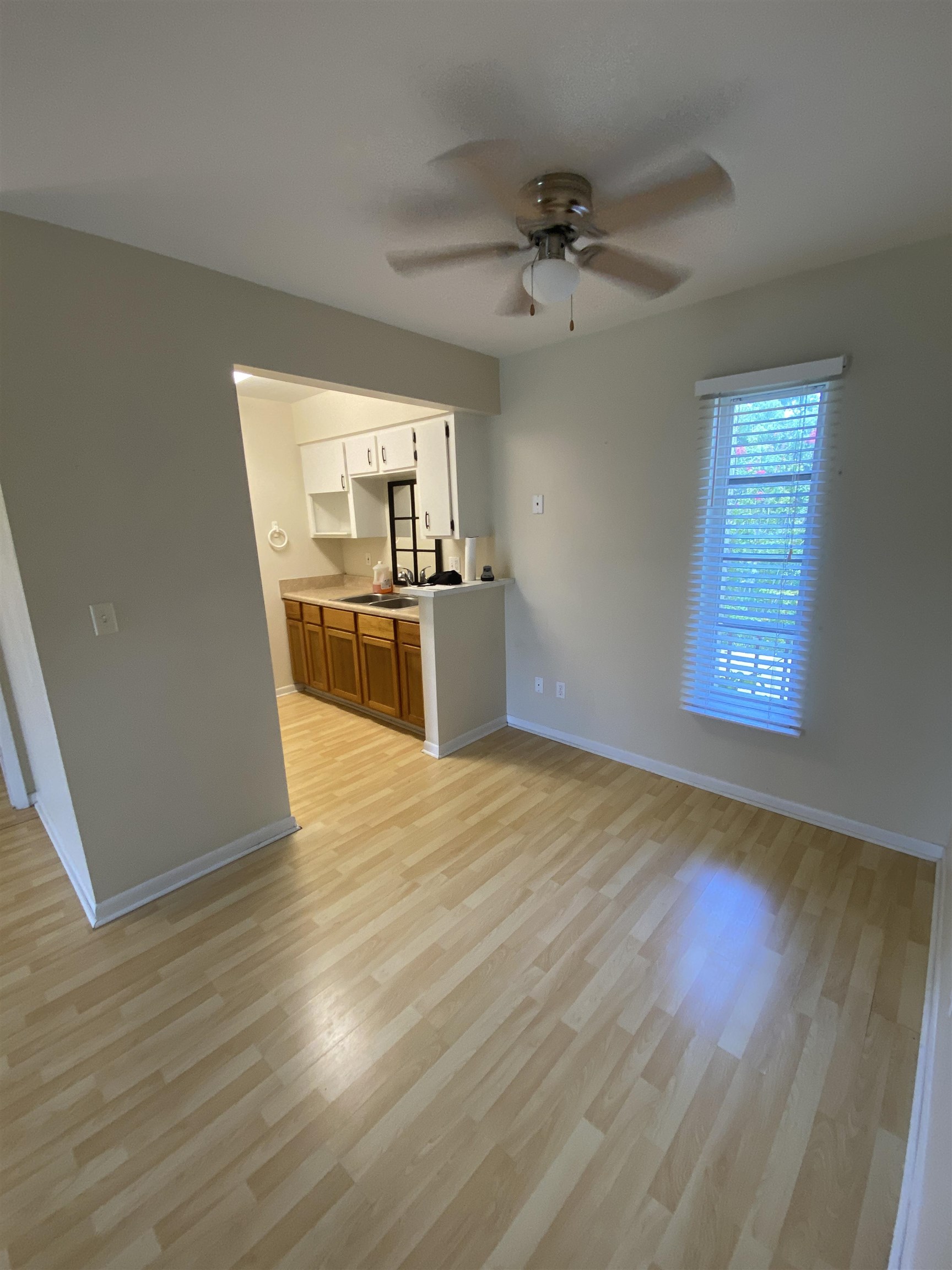 600 Domenico Circle, Unit C16 St. Augustine, FL 32086 - Photo 6 of 23 a view of a kitchen with a stove wooden floor and a kitchen space