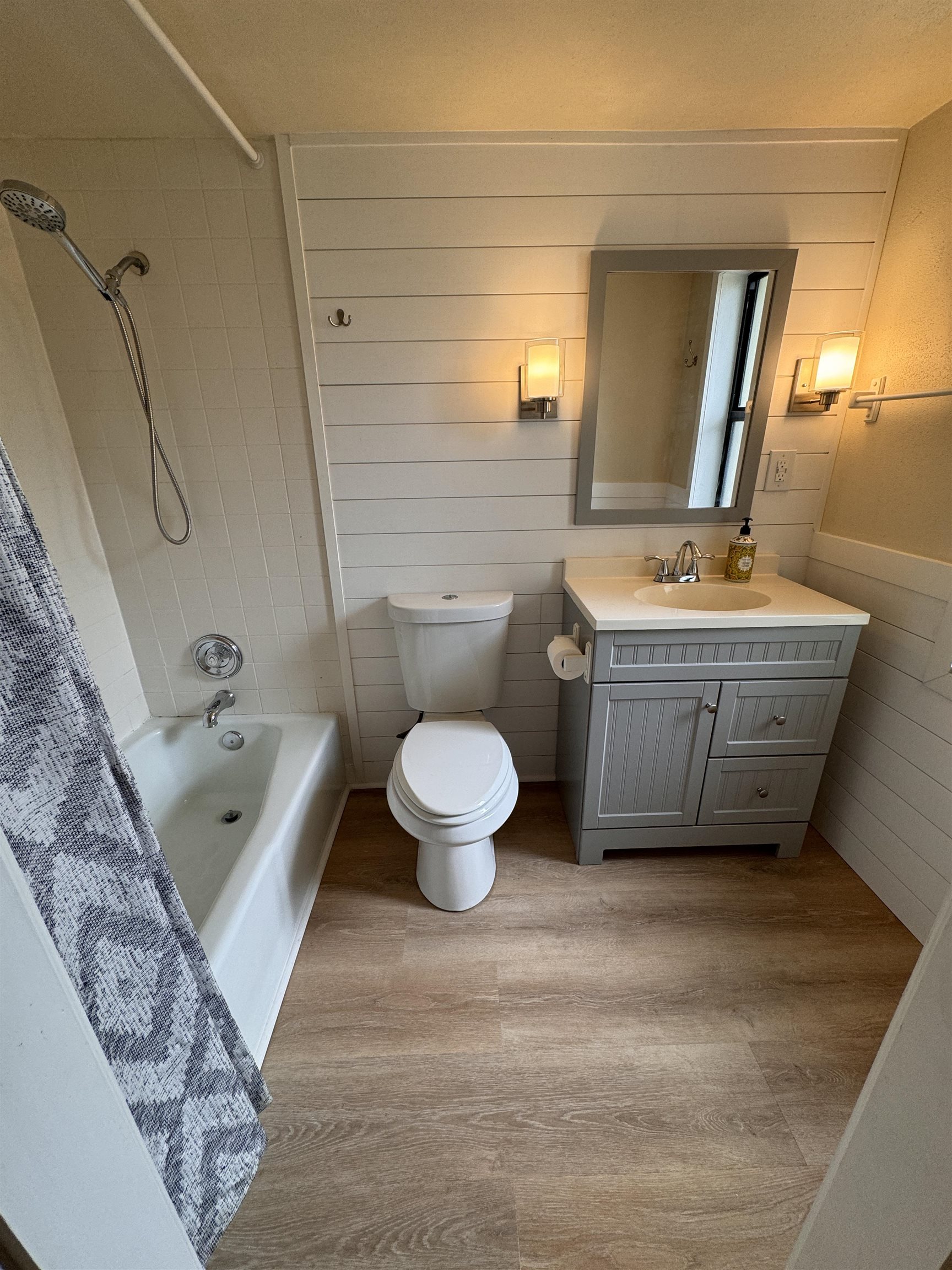600 Domenico Circle, Unit C16 St. Augustine, FL 32086 - Photo 7 of 23 a bathroom with a granite countertop toilet a sink and bathtub