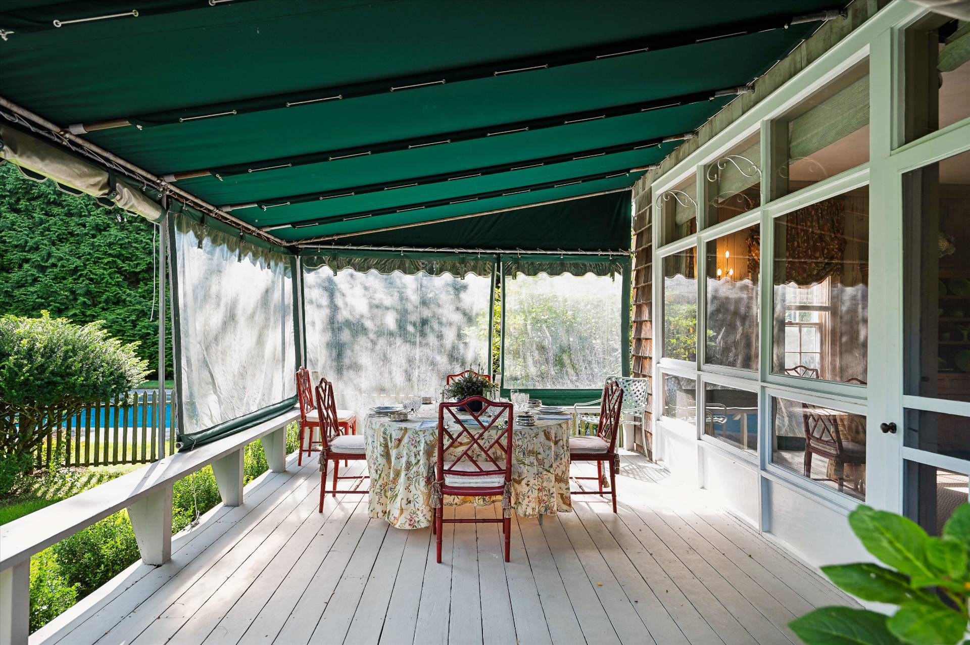 32 Ox Pasture Road Southampton, NY 11968 - Photo 20 of 25 a view of a chairs and table in patio with wooden floor