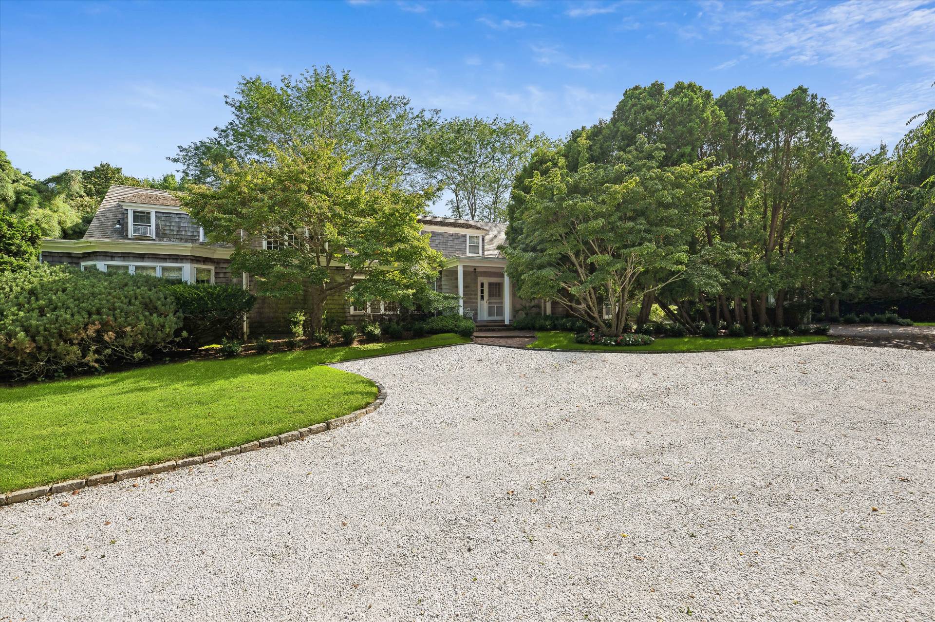 32 Ox Pasture Road Southampton, NY 11968 - Photo 6 of 25 a view of a house with a yard