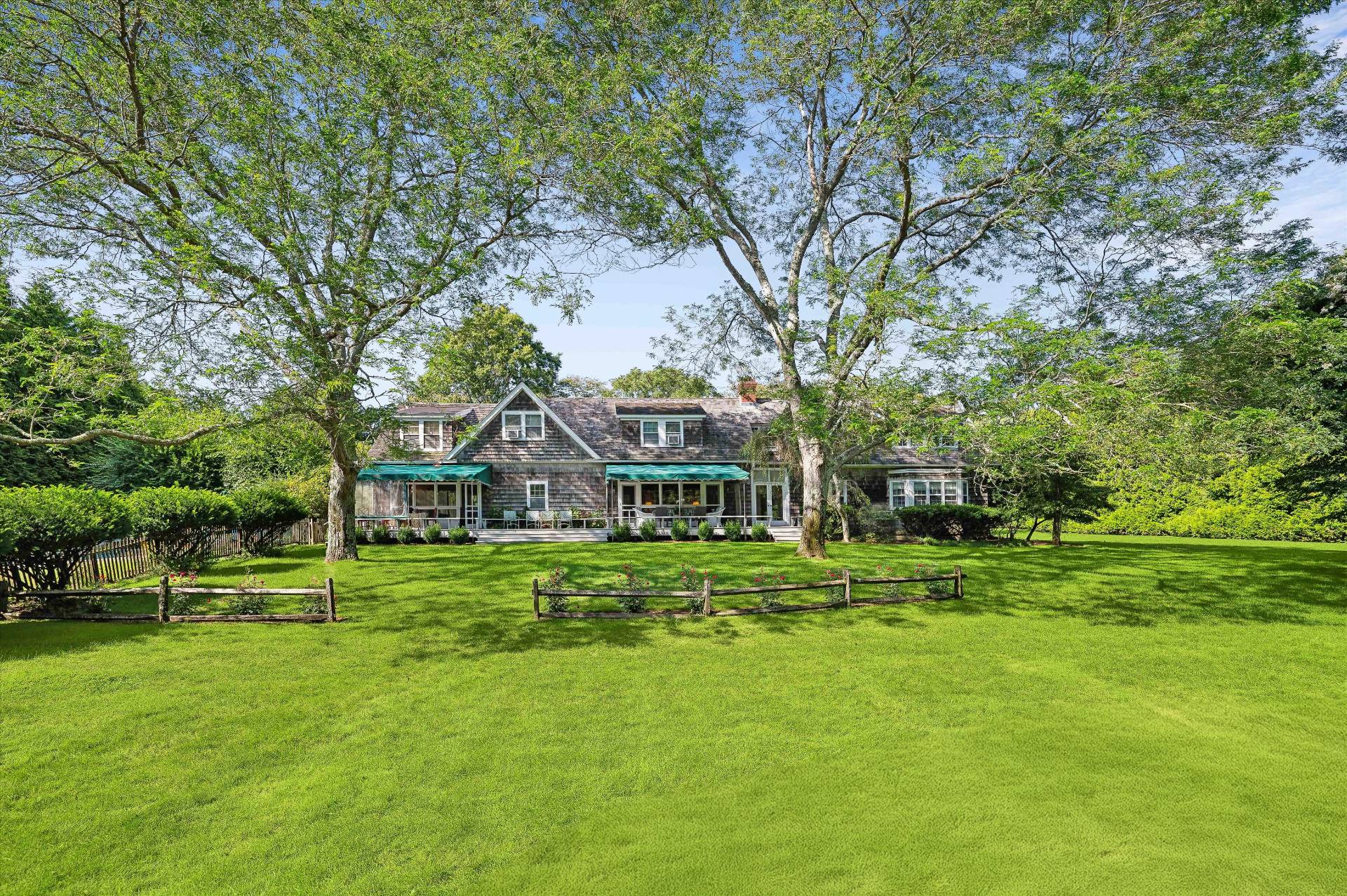 32 Ox Pasture Road Southampton, NY 11968 - Photo 7 of 25 a front view of a house with a garden