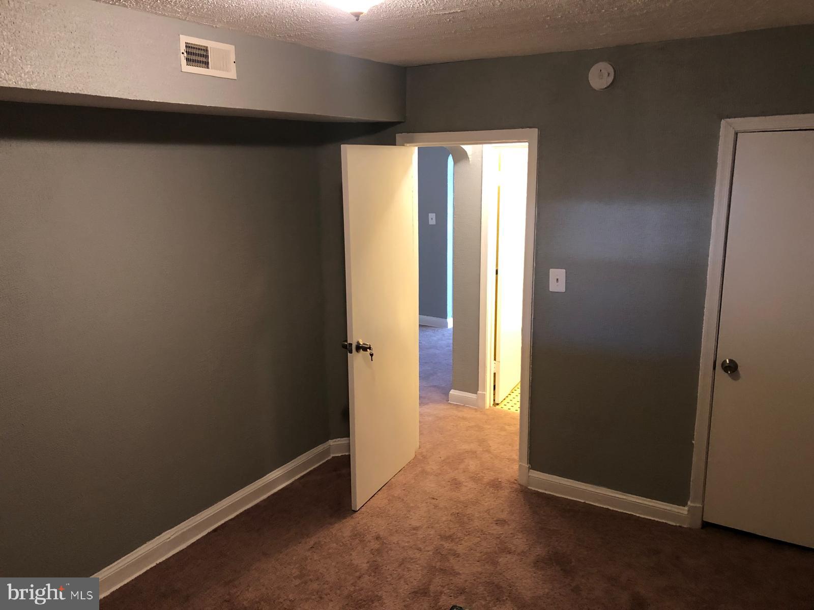 2812 2nd Street Southeast Washington, DC 20032 - Photo 5 of 7 an empty room with windows