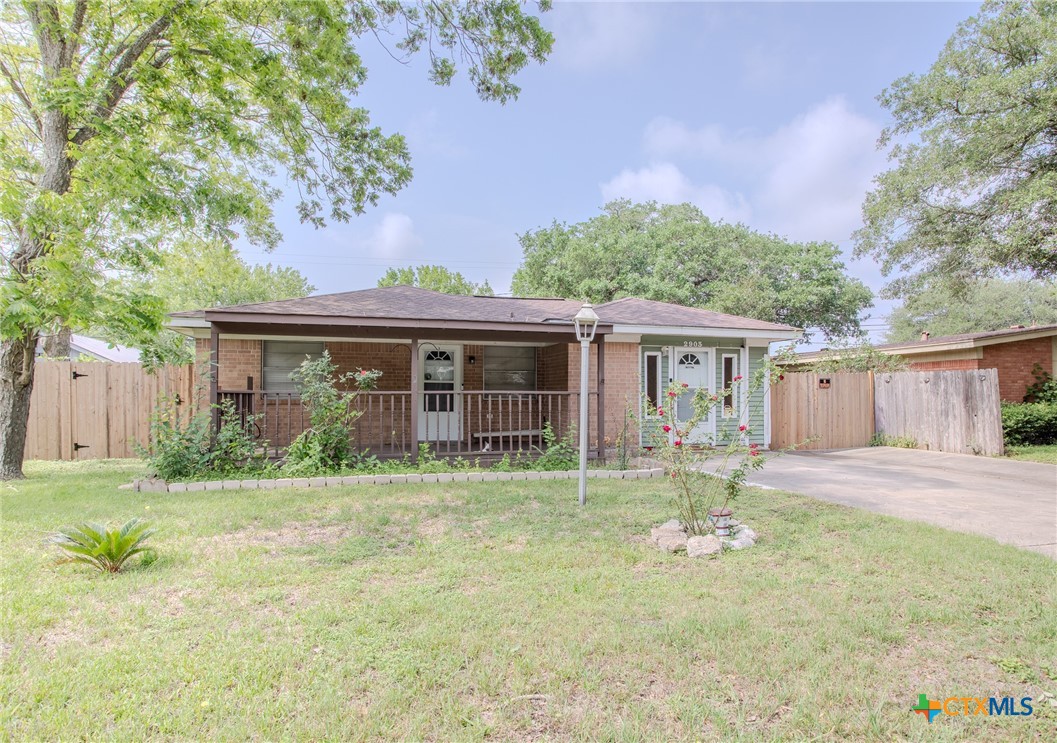 2903 Gayle Street Victoria, TX 77901 - Photo 1 of 21 a front view of a house with garden