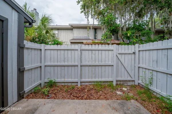 a front view of a house with a fence