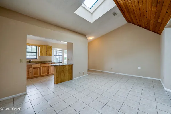 an empty room with a kitchen