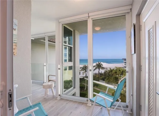 a bathroom with a granite countertop double vanity sink a mirror and a shower