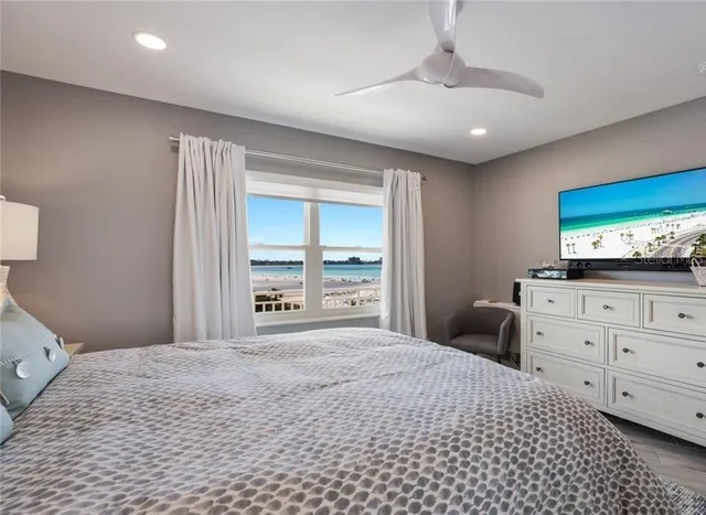 a bathroom with a sink double vanity granite tub shower and a mirror