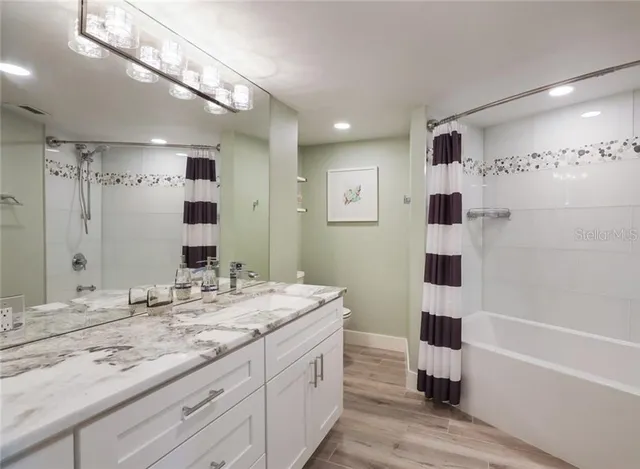 a bedroom with a bed and a view of balcony