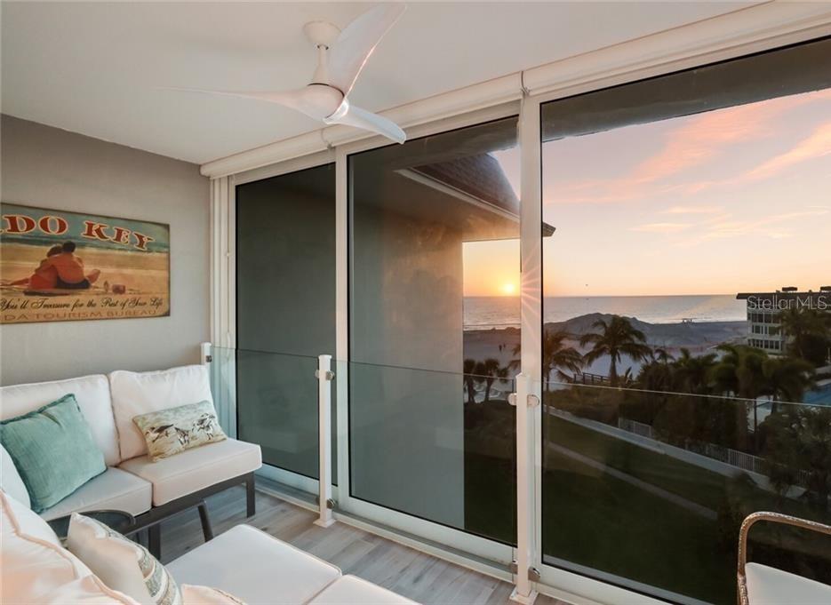 2110 Benjamin Franklin Drive, Unit 503SEA Sarasota, FL 34236 - Photo 17 of 29 a balcony with furniture