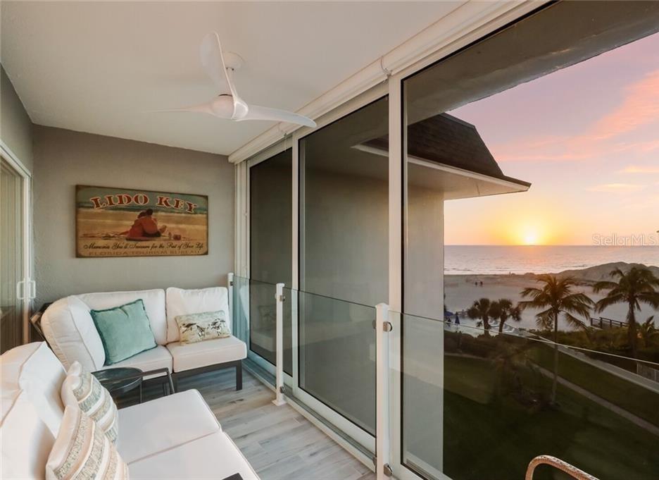 2110 Benjamin Franklin Drive, Unit 503SEA Sarasota, FL 34236 - Photo 18 of 29 a living room with furniture