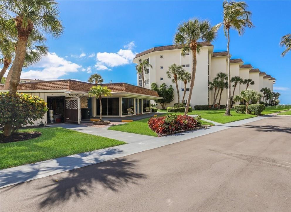 2110 Benjamin Franklin Drive, Unit 503SEA Sarasota, FL 34236 - Photo 24 of 29 a front view of a house with garden