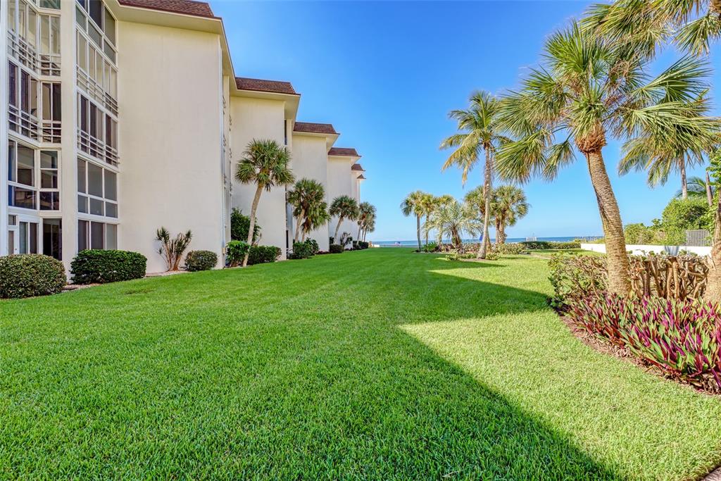 2110 Benjamin Franklin Drive, Unit 503SEA Sarasota, FL 34236 - Photo 28 of 29 a view of a garden with a building