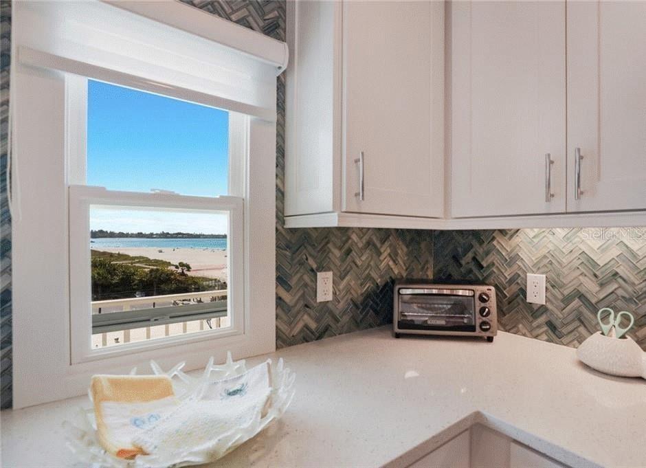 2110 Benjamin Franklin Drive, Unit 503SEA Sarasota, FL 34236 - Photo 9 of 29 a living room with furniture
