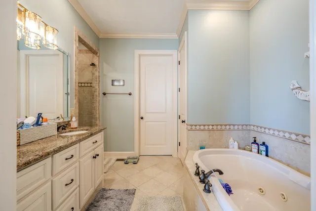 a bathroom with a granite countertop sink mirror and double