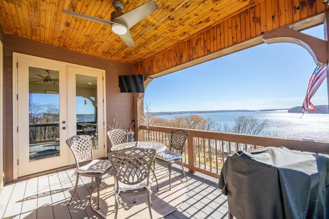 a view of a balcony with furniture