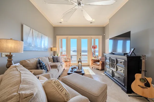a spacious bedroom with a bed and a chandelier