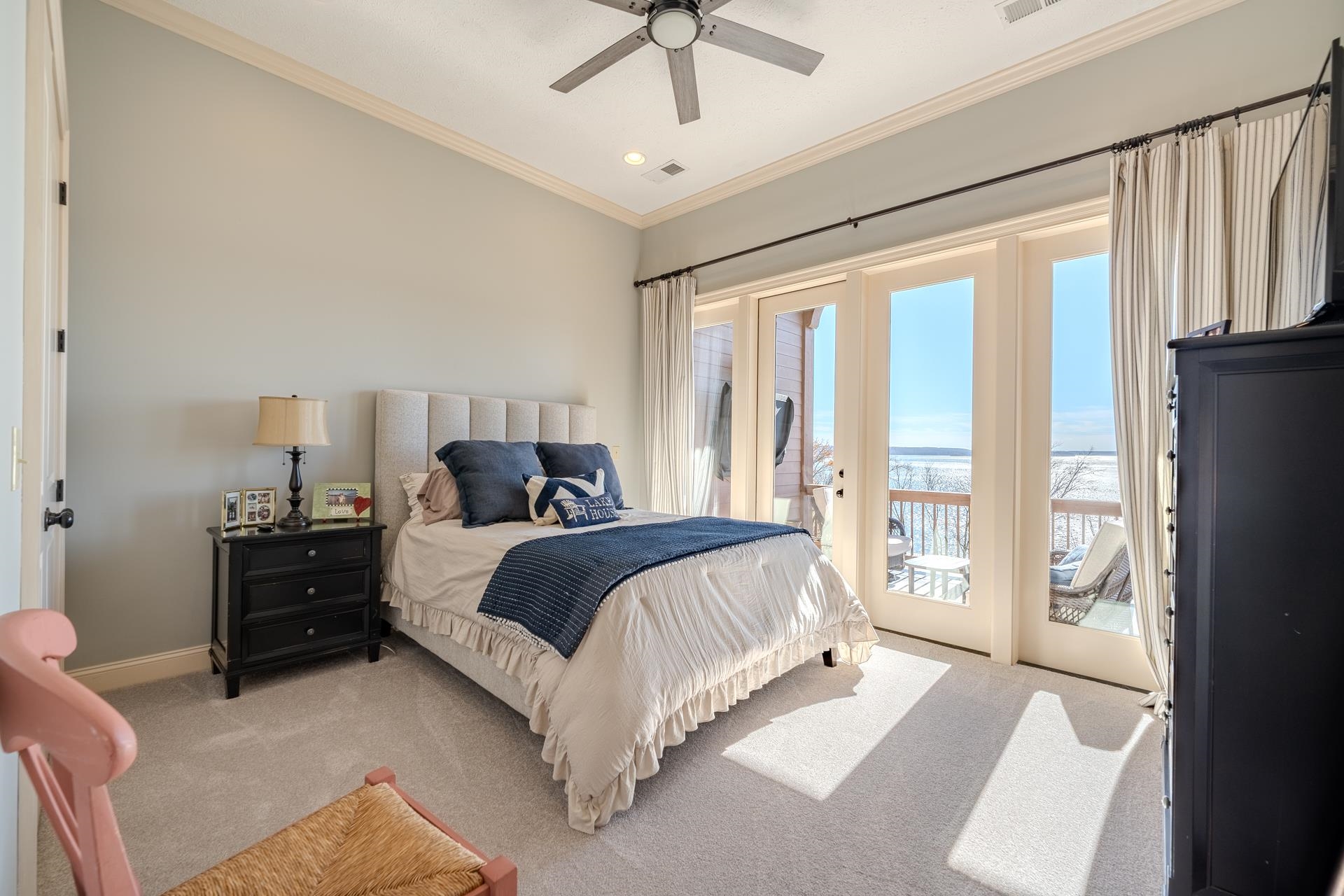 75 C Oasis Lane Savannah, TN 38372 - Photo 28 of 38 a spacious bedroom with a bed and a chandelier