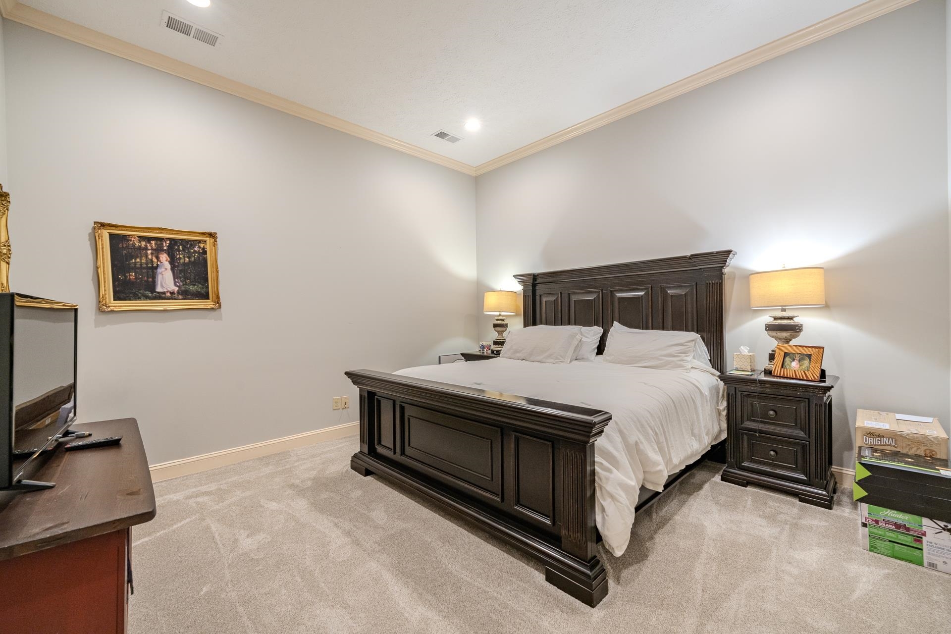75 C Oasis Lane Savannah, TN 38372 - Photo 29 of 38 a bedroom with a bed and a flat tv screen on the dresser