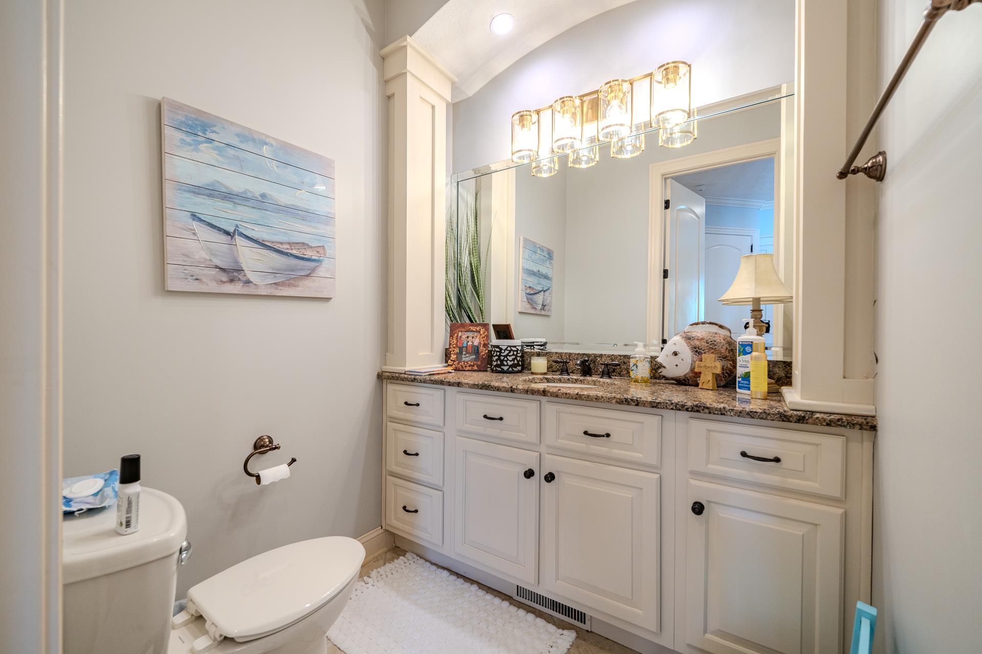 75 C Oasis Lane Savannah, TN 38372 - Photo 30 of 38 a bathroom with a granite countertop sink a toilet and a mirror