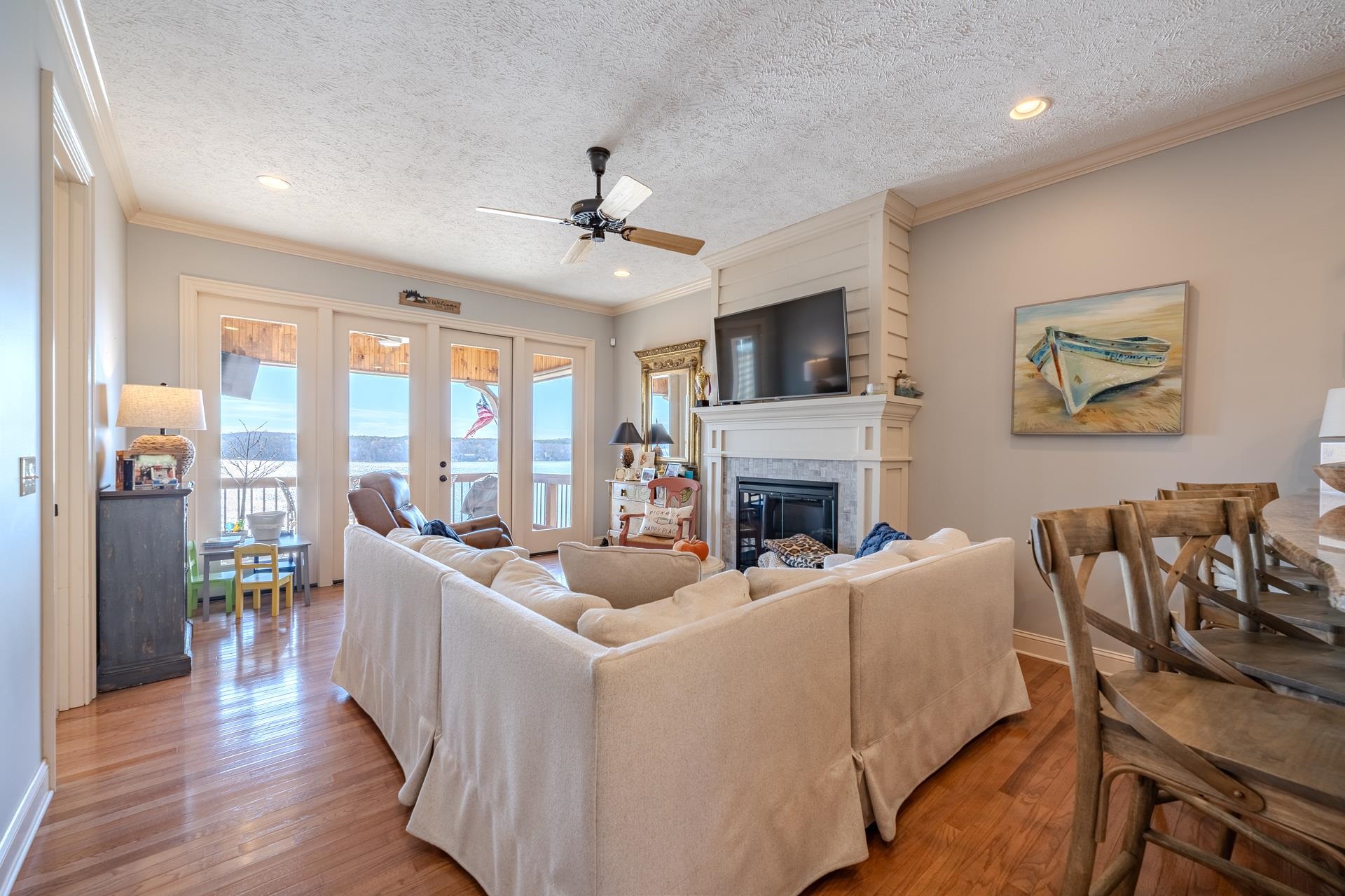75 C Oasis Lane Savannah, TN 38372 - Photo 4 of 38 a living room with furniture a fireplace and a flat screen tv