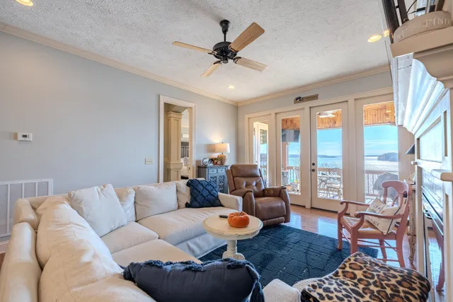 a living room with furniture fireplace and flat screen tv