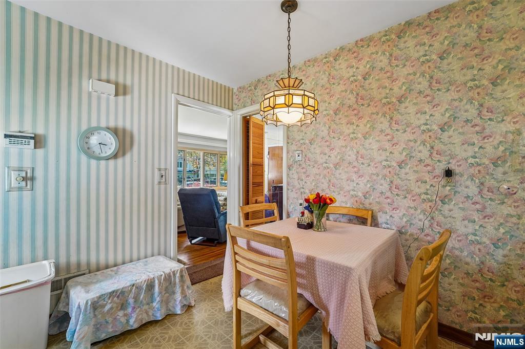 193 Homestead Road Paramus, NJ 07652 - Photo 14 of 33 a view of a dining room with furniture and a chandelier