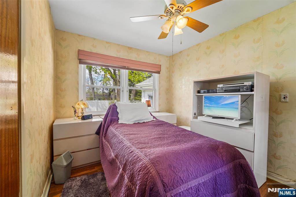 193 Homestead Road Paramus, NJ 07652 - Photo 16 of 33 a bedroom with a bed and a chandelier