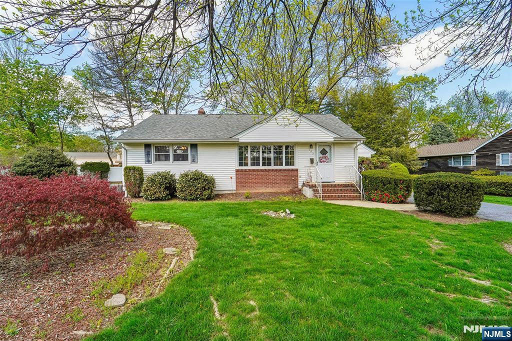 193 Homestead Road Paramus, NJ 07652 - Photo 2 of 33 a view of a house with a yard and large trees