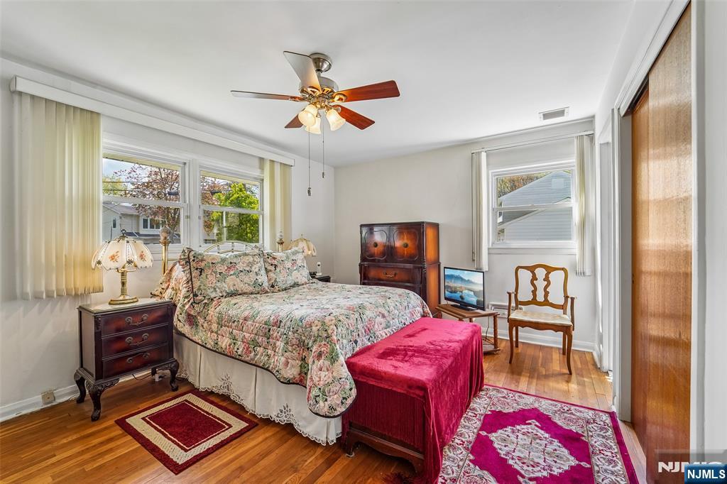 193 Homestead Road Paramus, NJ 07652 - Photo 23 of 33 a bedroom with a bed and wooden floor
