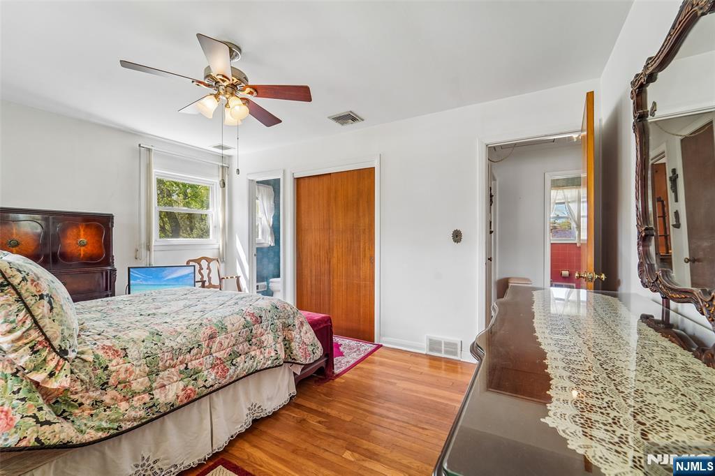 193 Homestead Road Paramus, NJ 07652 - Photo 25 of 33 a bedroom with a bed and wooden floor