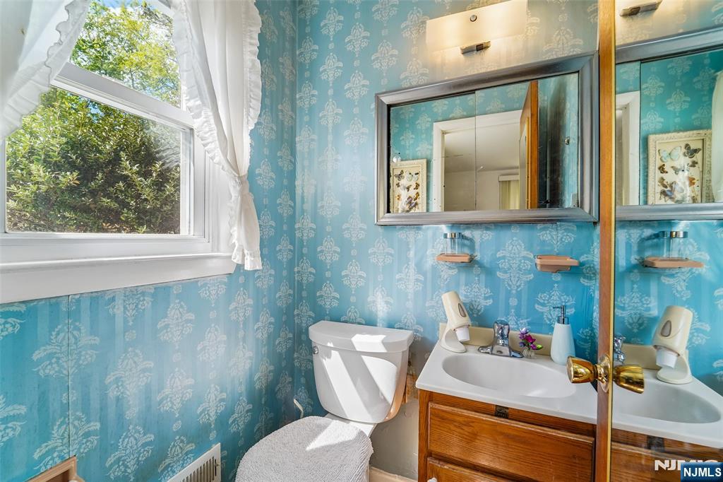 193 Homestead Road Paramus, NJ 07652 - Photo 26 of 33 a bathroom with a toilet sink and mirror