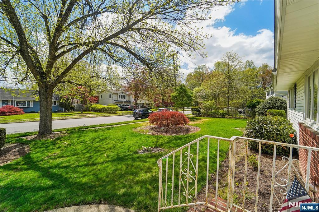 193 Homestead Road Paramus, NJ 07652 - Photo 5 of 33 a view of a yard with swimming pool and sitting area