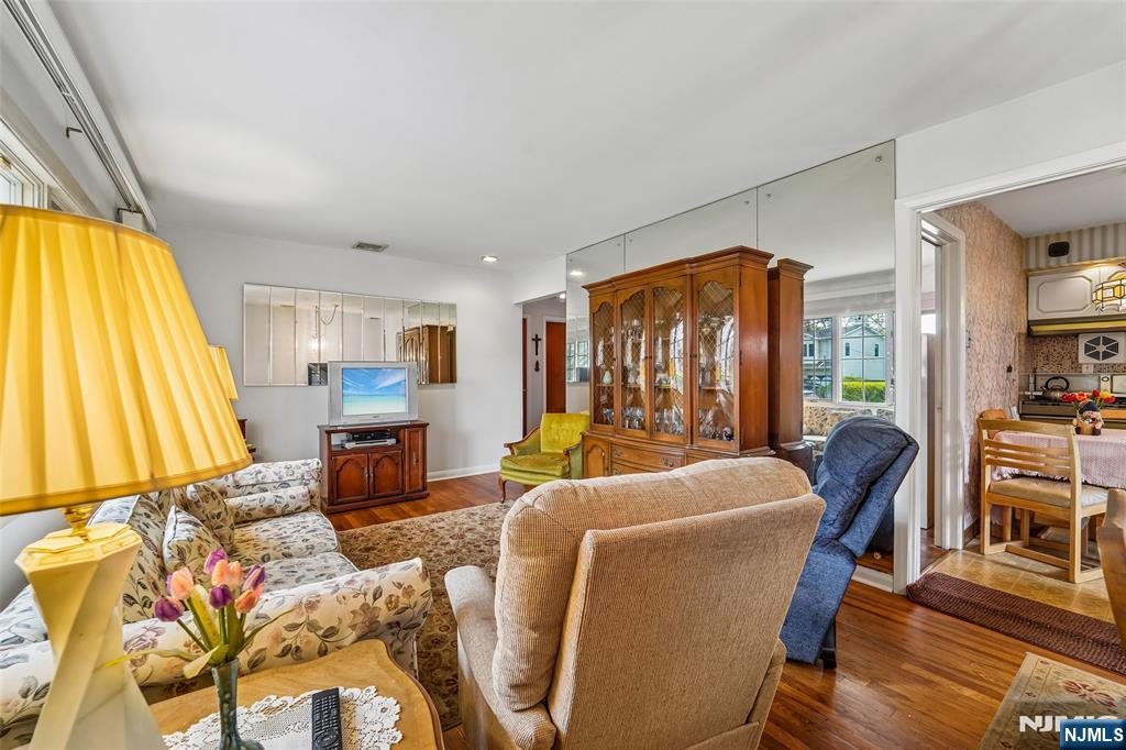 193 Homestead Road Paramus, NJ 07652 - Photo 6 of 33 a living room with furniture a fireplace and a large window